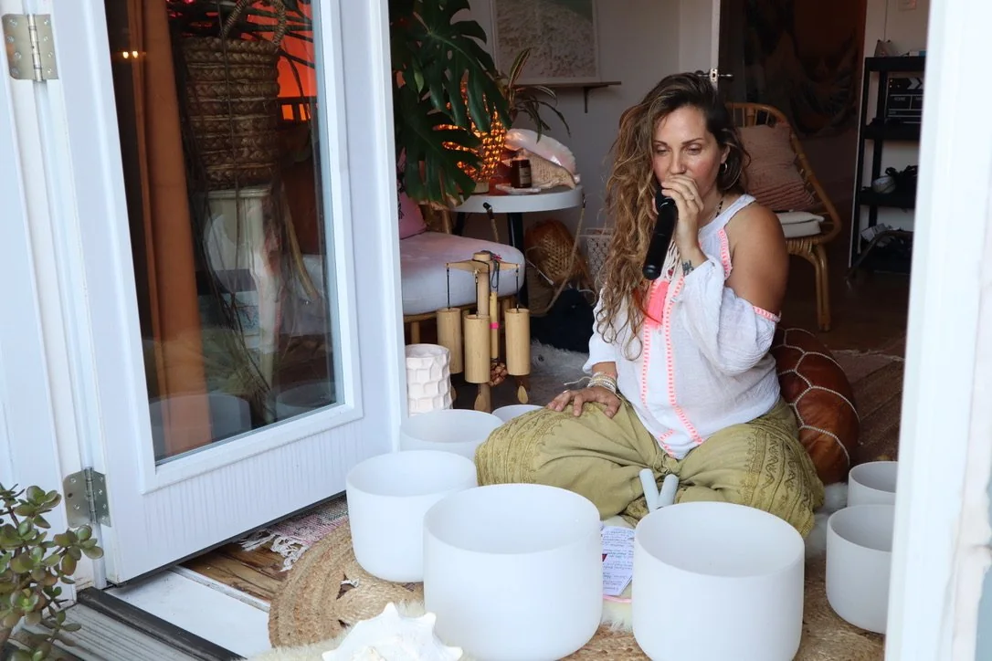 Kristina among crystal singing bowls